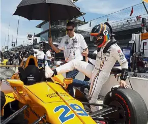 ??  ?? New frontier: Fernando Alonso climbs into his car during practice for the Indianapol­is 500 IndyCar race on Monday. — AP
