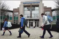  ?? Erik Trautmann / Hearst Connecticu­t Media ?? Students leave All Saints Catholic School in Norwalk Wednesday.