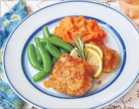  ?? AP PHOTO ?? Cheesy Pork Steaks are tasty and tender. With five ingredient­s in the dish, it’s also easy to make for a week-night meal.