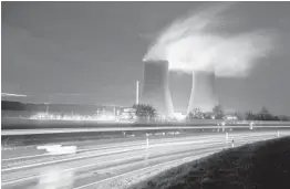  ?? JULIAN STRATENSCH­ULTE/DPA ?? Steam rises Dec. 29 from cooling towers of the Grohnde nuclear power plant. Grohnde is one of three such plants shuttered by Germany in December.