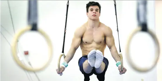  ?? JIM WELLS ?? University of Calgary gymnast Wolfe Gazer, going through his routine on the rings during a training session at U of C, is preparing for the May 31-June 4 nationals in Calgary.