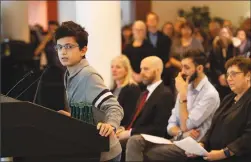  ?? Canadian Press photo ?? Ryan Pourjam, 13, son of Mansour Pourjam, speaks about his father during a ceremony at Carleton University to honour Pourjam, a biology alumnus, and biology PhD student Fareed Arasteh, who died in the crash of Ukraine Internatio­nal Airlines Flight PS752 in Tehran, in Ottawa on Wednesday.