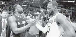  ?? MARCIO JOSE SANCHEZ/AP FILE ?? LeBron James, right, selected his former Heat teammate Dwyane Wade in the NBA All-Star Game draft Thursday night.