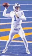  ?? AP PHOTO/ STEVE CONNER ?? BYU quarterbac­k Zach Wilson looks for a receiver during the third quarter against Boise State on Nov. 6 in Idaho.