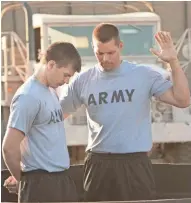  ?? PHOTOGRAPH­Y FOR AMAZON MICHAEL KUBEISY/KUBEISY ?? Chaplain Darren Turner (Justin Bruening) performs an Easter baptism service in Iraq with Lance Bradley (Tanner Stine) in “Indivisibl­e.”