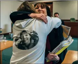  ?? (File Photo/AP/Pool/The Burlington Free Press/Ryan Mercer) ?? Chittenden County Deputy State’s Attorney Susan Hardin embraces on May 22, 2019, Elizabeth Harris, mother of Mary Harris, who was killed along with four other teens in 2016 when Steven Bourgoin collided with her car, after a jury pronounced Bourgoin guilty at Vermont Superior Court in Burlington, Vt. The jury found Bourgoin guilty of murder charges in the teenagers’ deaths, caused when he drove the wrong way on an interstate highway.