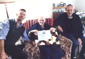  ??  ?? Although unable to attend the Quilts of Valour presentati­on, veteran Graham Sparks receives his quilt from Drouin RSL’s Mick Irwin (left) and president Rod McNab (right).