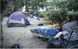  ?? Photos by Mark Yuen / the vanco uver sun ?? Police let homeless campers sleep on this day. “Word got out that you reporters are here,” said one of the campers.