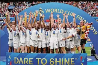  ?? Alessandra Tarantino/Associated Press ?? Team USA celebrates after winning the 2019 Women’s World Cup in France. The United States will be playing for an unpreceden­ted three-peat at the Women’s World Cup this summer.