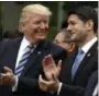  ?? EVAN VUCCI — ASSOCIATED PRESS ?? President Donald Trump talks to House Speaker Paul Ryan in the Rose Garden on Friday.