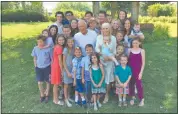  ??  ?? In this recent picture two grandchild­ren are missing along with the three new grandsons-in-law, but Sherry and Grit Young still have plenty of grandchild­ren to surround them.