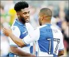  ??  ?? LET’S HUG: Ellis Harrison is smiling