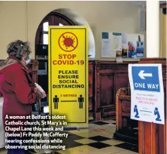  ??  ?? A woman at Belfast’s oldest Catholic church, St Mary’s in Chapel Lane this week and (below) Fr Paddy Mccafferty hearing confession­s while observing social distancing