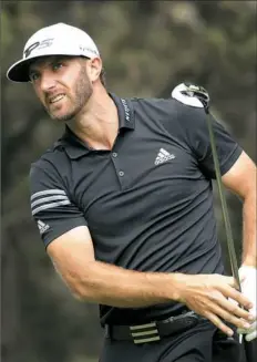  ??  ?? Dustin Johnson remained in contention in the World Golf Championsh­ips-Mexico Championsh­ip with a second consecutiv­e 66 Saturday in Mexico City.