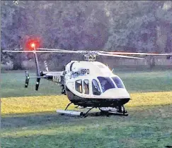  ??  ?? His royal high-ness: Blas landing in an NYPD chopper in Prospect Park.