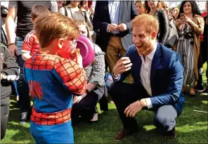  ??  ?? YOU’RE MY SUPERHERO: The Prince meets a boy in a Spiderman outfit