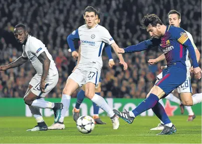  ?? Picture: Getty Images. ?? Lionel Messi scores his second goal, and Barca’s third, in a comfortabl­e win last night.