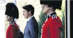  ?? JUSTIN TANG / THE CANADIAN PRESS ?? Prime Minister Justin Trudeau arrives for a press conference following a swearing-in ceremony on Wednesday.