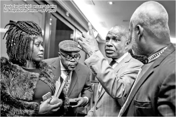  ??  ?? Fayulu (second right) gestures following his designatio­n in Geneva. — AFP photo