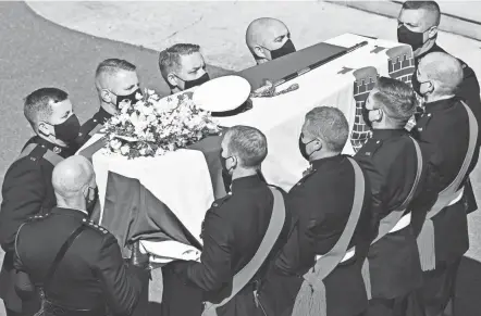  ?? JUSTIN TALLIS/POOL VIA AP ?? Prince Philip’s coffin arrives at St. George’s Chapel inside Windsor Castle in Windsor, England on Saturday. Philip died April 9 at age 99.