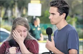  ?? Mark Wilson Getty Images ?? STUDENTS Kelsey Friend and David Hogg recall the shooting at their Parkland, Fla., high school. Right-wing news outlets have accused Hogg of being an actor.