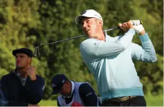  ??  ?? Matt Kuchar hits a tee shot on the 4th hole during the continuati­on of the first round of the Genesis Open at Riviera Country Club in Pacific Palisades, California. — AFP photo