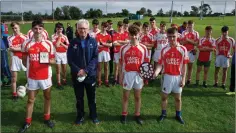  ??  ?? Patrick Murphy with his man of the match trophy and Ballinglen Captains Conor Byrne and Rory O’Dare along with Owen Doyle.