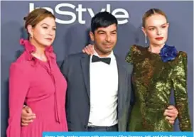  ??  ?? Harry Josh, center, poses with actresses Ellen Pompeo, left, and Kate Bosworth.