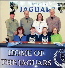  ??  ?? Hannah Carr (second from left) and Olivia Williams (second from right) signed on to continue their basketball careers with the Lady Bobcats this past Wednesday during a ceremony at Georgia Cumberland Academy in Calhoun. Also on hand were Mark and...