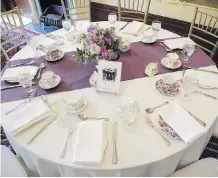  ??  ?? Beautifull­y set tables complete with stunning flowers and vintage cup and saucers set the tone for the Lady Grey Tea at Lougheed House.