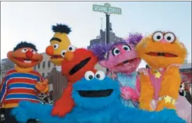  ?? KATHY WILLENS — THE ASSOCIATED PRESS FILE ?? In this file photo, characters from Sesame Street Live appear on the street by Madison Square Garden to celebrate the 30th anniversar­y of the live touring stage shows based on the PBS television series. in New York.