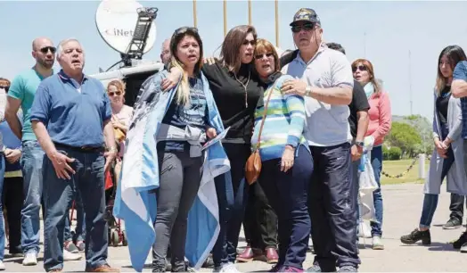  ?? Agence France-presse ?? Relatives of missing Argentine submarine crew member Celso Oscar Vallejos gather outside the Navy base in Mar del Plata on Saturday.