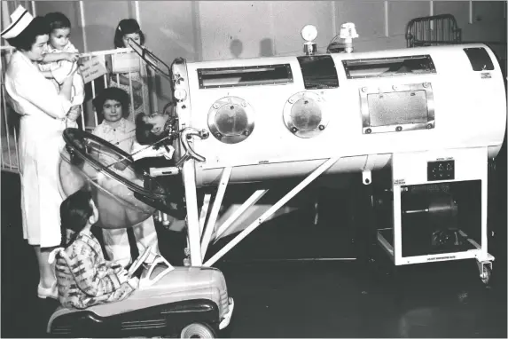  ??  ?? Patients who contracted “bulbar” polio had trouble swallowing, talking, moving and breathing. The only way they could survive, says Jean Jenny, was in an iron lung, as shown in April 1955.