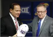  ?? ORLIN WAGNER — THE ASSOCIATED PRESS FILE ?? In this Nov. 18, 2018, file photo, Les Miles, left, is introduced as Kansas football coach by athletic director Jeff Long, right, during a news conference in Lawrence, Kan. Kansas has fired athletic director Jeff Long less than two days after mutually parting with Les Miles amid sexual misconduct allegation­s dating to the football coach’s time at LSU, a person familiar with the decision told The Associated Press on Wednesday.
