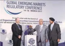  ??  ?? Prime Minister Datuk Seri Najib Abdul Razak launches IOSCO’s Asia Pacific hub. With him are Ranjit (right) and IOSCO Board chairman Ashley Alder.