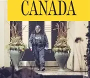  ?? PETER J THOMPSON / NATIONAL POST ?? An officer leaves the north Toronto home of philanthro­pists Honey and Barry Sherman. Both were found dead inside.