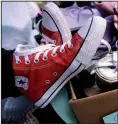  ?? Arkansas Democrat-Gazette/THOMAS METTHE ?? The red Converse All Star high-tops Karla Allen wears to all the events promoting Ozark Water Projects have become her trademark.