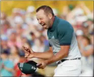  ?? MATT SLOCUM — THE ASSOCIATED PRESS ?? Sergio Garcia, of Spain, reacts after making his birdie putt on the 18th green to win the Masters golf tournament in a playoff Sunday in Augusta, Ga.