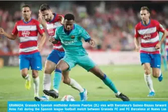  ??  ?? GRANADA: Granada’s Spanish midfielder Antonio Puertas (2L) vies with Barcelona’s Guinea-Bissau forward Ansu Fati during the Spanish league football match between Granada FC and FC Barcelona at Nuevo Los Carmenes stadium in Granada. — AFP