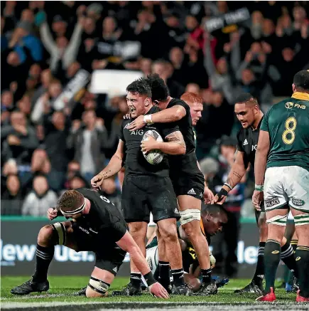  ?? PHOTO: GETTY IMAGES ?? All Blacks forward Codie Taylor celebrates with teammates after scoring a try during the Rugby Championsh­ip match against the Springboks at QBE Stadium in Albany on Saturday night.
