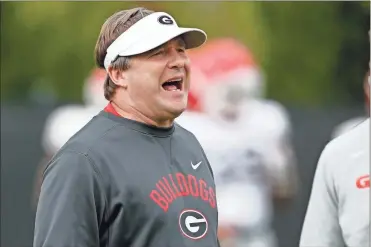  ?? Athens Banner-Herald via AP - Joshua L. Jones, file ?? Georgia coach Kirby Smart will kick off the delayed 2020 season at Arkansas, facing off against his former offensive line coach, new Razorbacks head coach Sam Pittman.