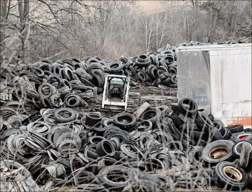  ?? Photos by Will Waldron / Times Union ?? This was the scene Friday at a Coxsackie tire dump on Route 81 that town officials have been fighting to have cleaned up.