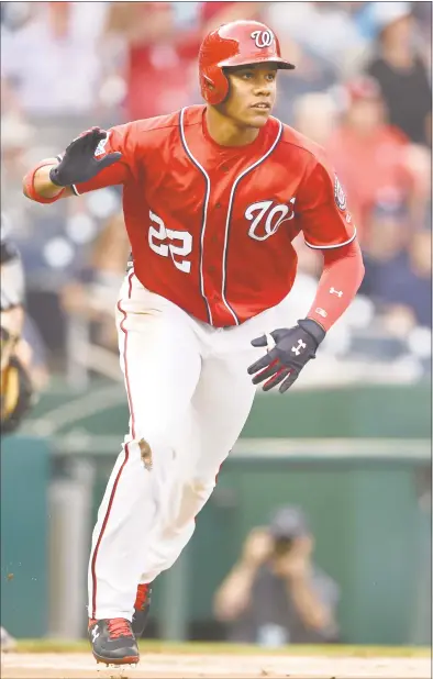  ?? Mitchell Layton / Getty Images ?? Juan Soto of the Nationals hits a two-run home run in the sixth inning of the first game against the Yankees Monday at Nationals Park in Washington.