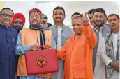  ?? — PTI ?? Uttar Pradesh chief minister Yogi Adityanath (R) and finance minister Suresh Khanna before the presentati­on of State Budget 2020-21 in the UP Legislativ­e Assembly, in Lucknow, Tuesday.