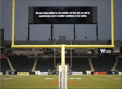  ?? JOHN WOODS, THE CANADIAN PRESS ?? Fans clear the stands due to a severe thundersto­rm watch and some lightning in the area prior to a scheduled CFL contest between the Blue Bombers and the Hamilton Tiger-Cats in Winnipeg on Wednesday. The game was delayed more than two hour. For...