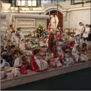  ?? SUBMITTED PHOTO ?? Statues of the baby Jesus line the steps in the sanctuary of St. Patrick’s Church.