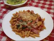  ?? LINDA GASSENHEIM­ER/TNS ?? Penne Arrabbiata (Penne with Spicy Tomato Sauce) and Italian Salad.