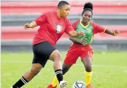  ?? RICARDO MAKYN/MULTIMEDIA PHOTO EDITOR ?? Arnett Gardens’ Lydia Hall moves away from Real MoBay’s Shaneel Facey during their Jamaica Women’s Premier League clash at the Anthony Spaulding Sports Complex yesterday.