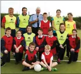  ??  ?? Referee Garda Seamus Moriarty with the teacher and pupils five a side teams at Spa N.S