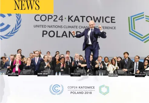  ?? JANEK SKARZYNSKI / AFP / GETTY IMAGES ?? Michal Kurtyka, a senior Polish official who chaired the climate summit in Katowice, Poland, has fun during the final session Saturday. Some environmen­talists and countries that wanted more ambitious goals were frustrated by the lack of decision-making at the summit.